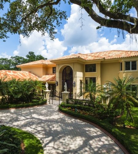 Luxury residential property with Mediterranean architecture and lush landscaping, representing estate planning and asset protection in Boca Raton