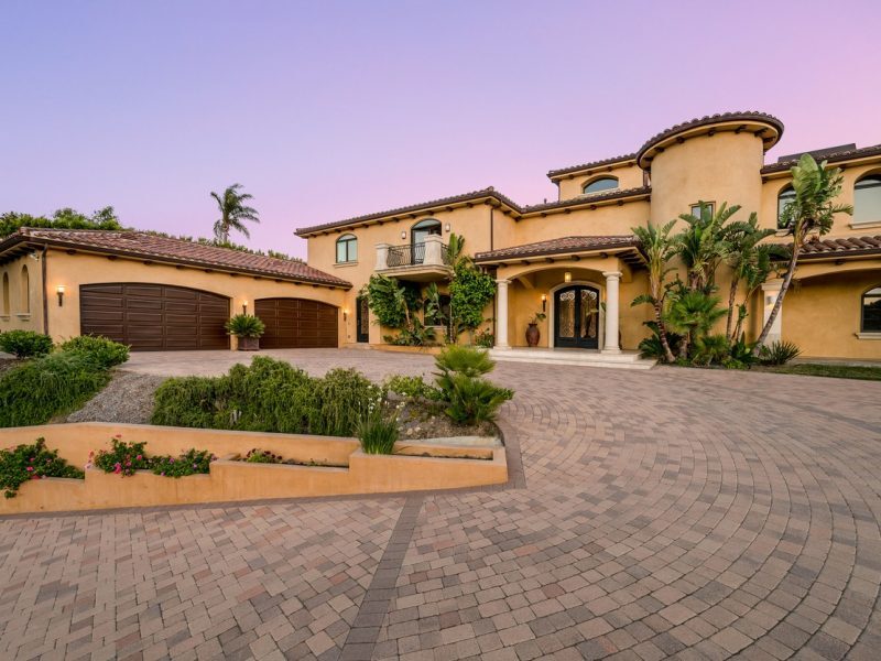 Upscale Mediterranean-style home at dusk, representing high-value property estate planning and asset protection in Boca Raton