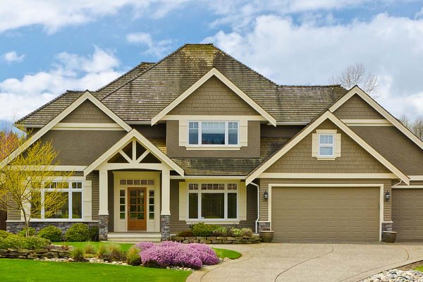 Spacious craftsman-style home with manicured landscaping, representing residential property estate planning and asset protection in Weston